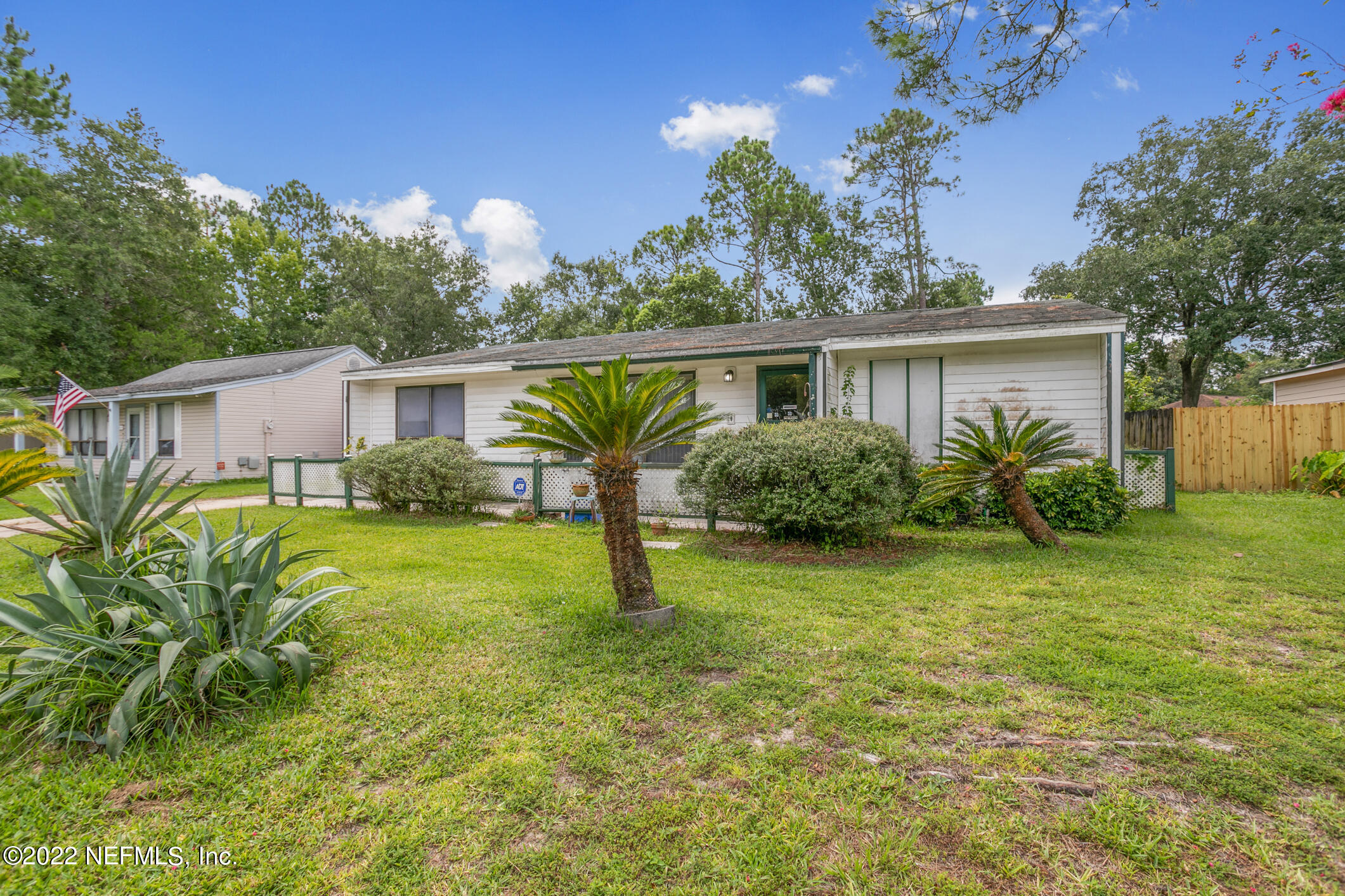 3150 Ricky Drive Jacksonville, FL 32223 - Photo 3 of 28 a view of a house with backyard and a garden