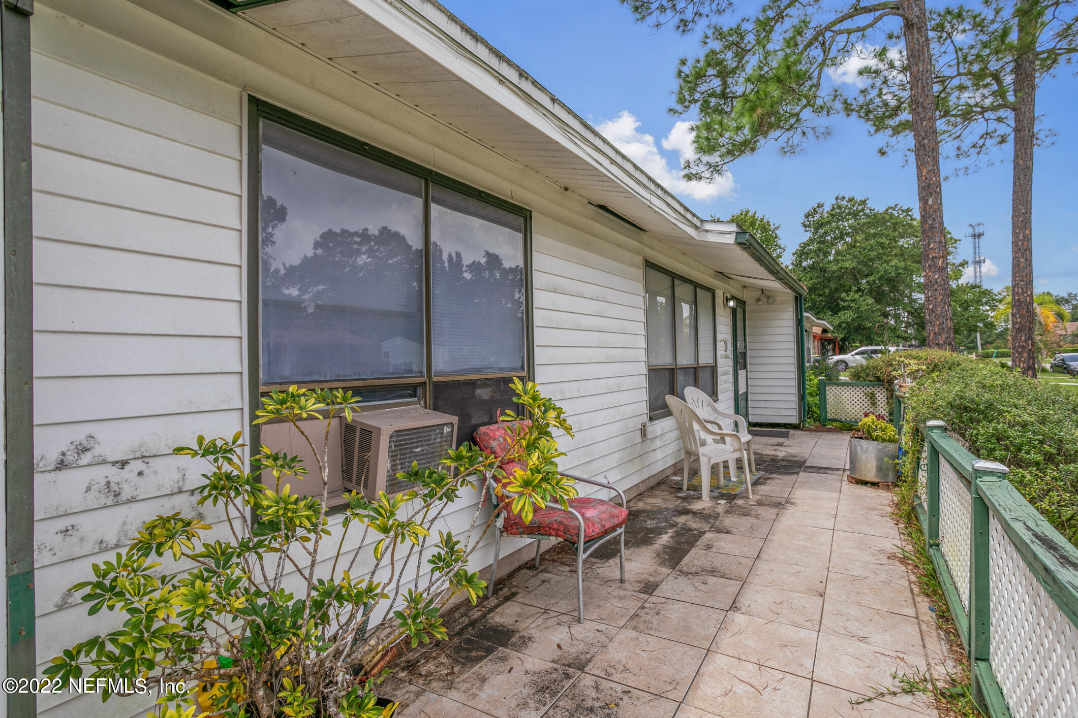 3150 Ricky Drive Jacksonville, FL 32223 - Photo 4 of 28 a backyard of a house with chairs