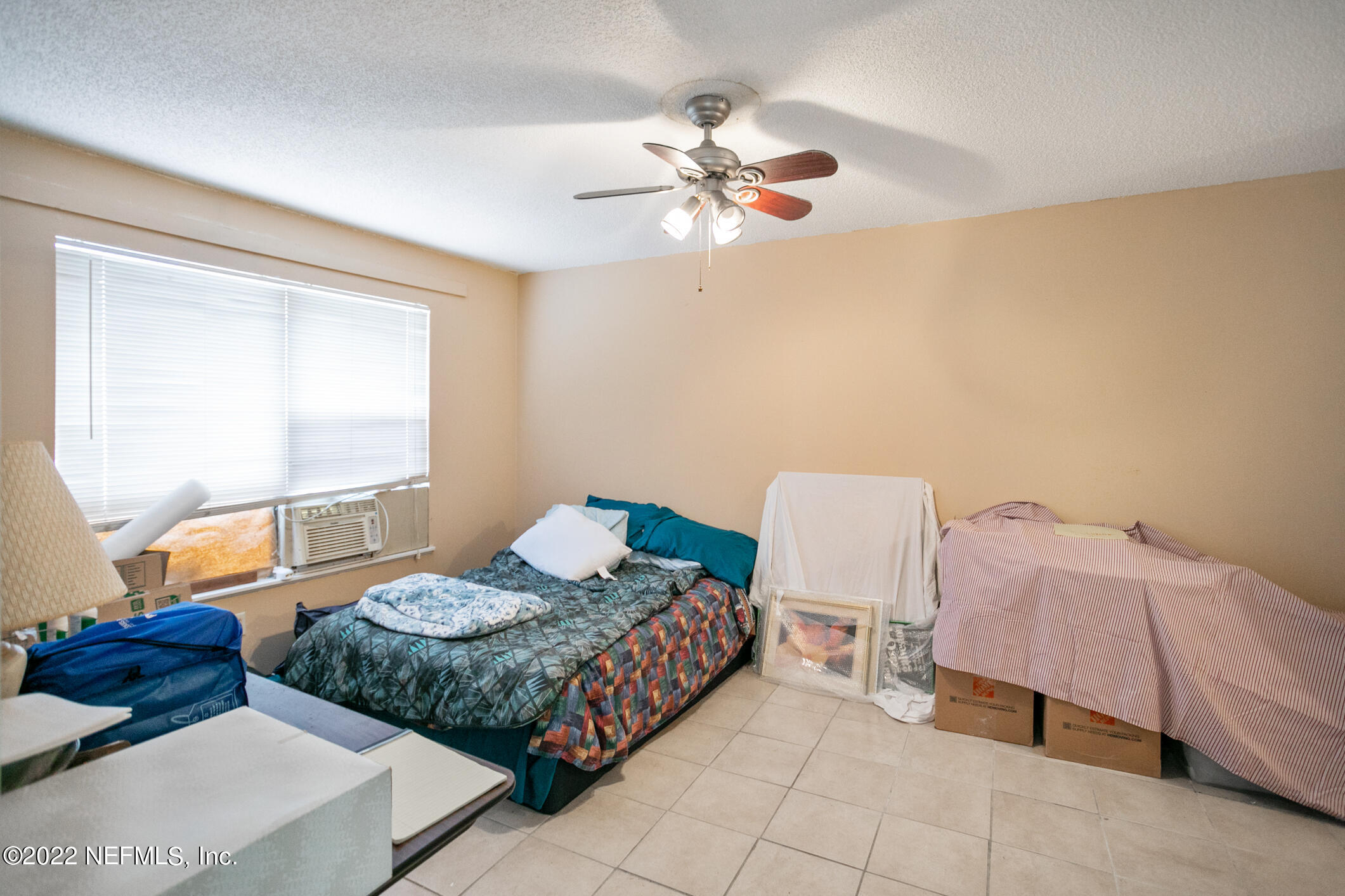 3150 Ricky Drive Jacksonville, FL 32223 - Photo 7 of 28 a bedroom with two beds and a chandelier