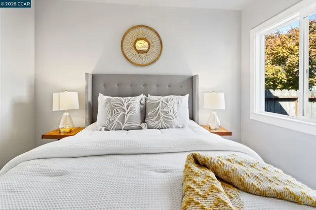 a bedroom with bed and a window