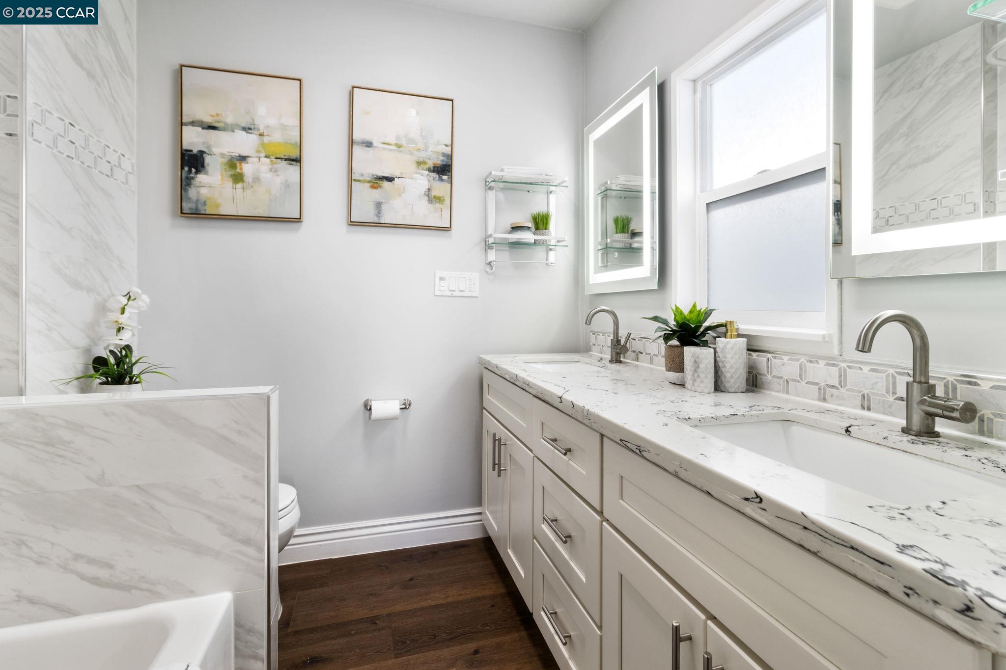 4010 Masterson Street Oakland, CA 94619 - Photo 13 of 27 a bathroom with a double vanity sink and a window