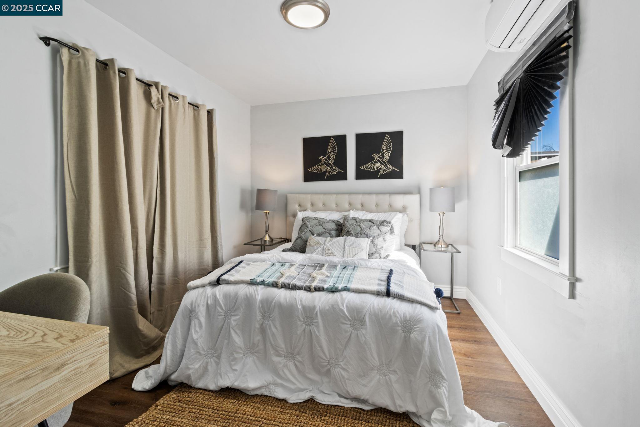 4010 Masterson Street Oakland, CA 94619 - Photo 15 of 27 a bedroom with a bed and flat screen tv