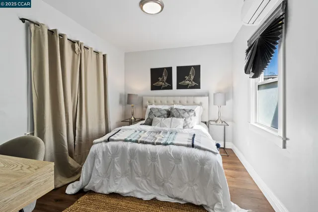 a bedroom with a bed and flat screen tv