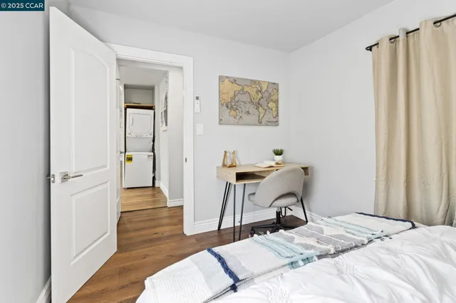 a bedroom with a bed and a table in it