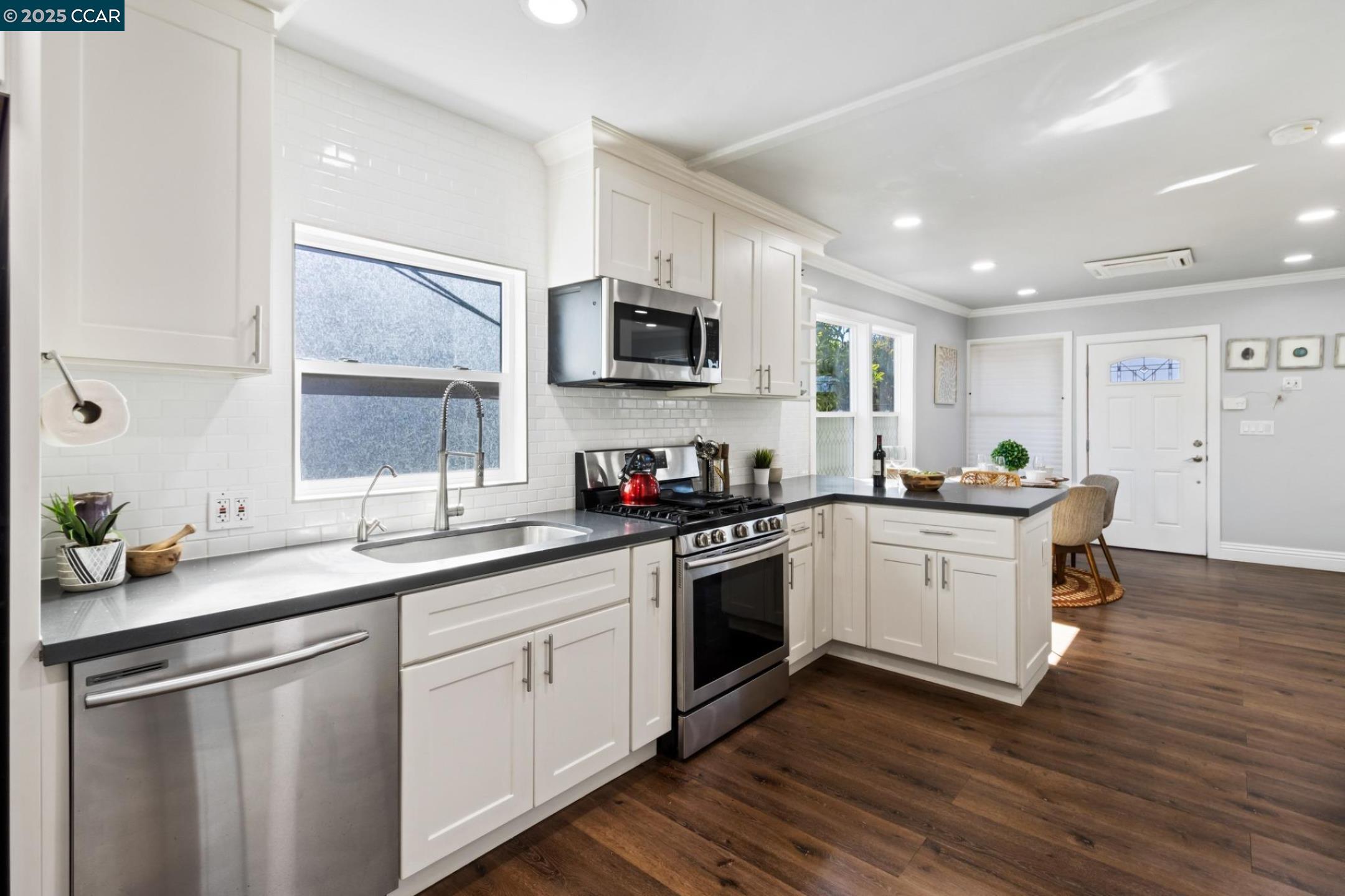 4010 Masterson Street Oakland, CA 94619 - Photo 8 of 27 a kitchen with a sink cabinets and stainless steel appliances