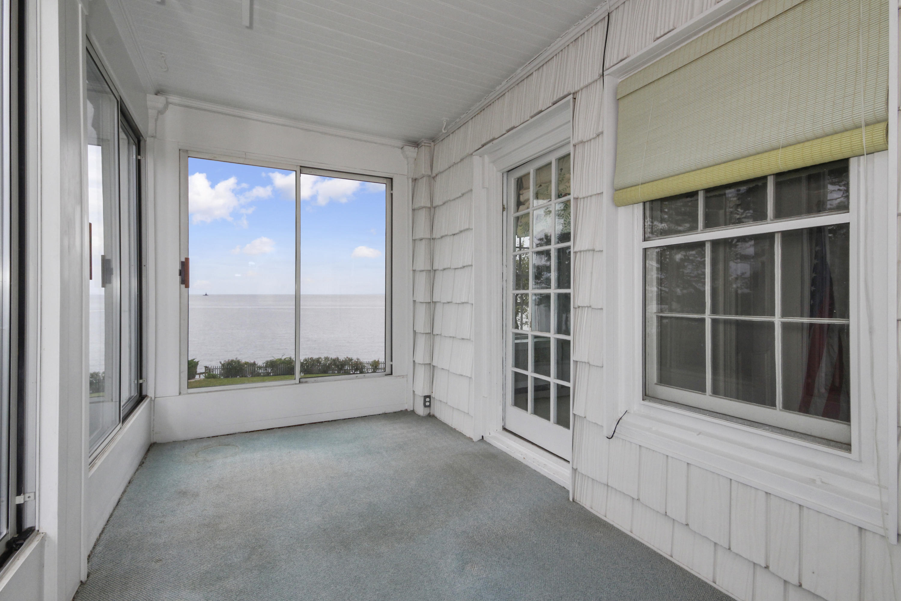 237 Long Neck Point Road Darien, CT 06820 - Photo 16 of 38 a view of an empty room with a window