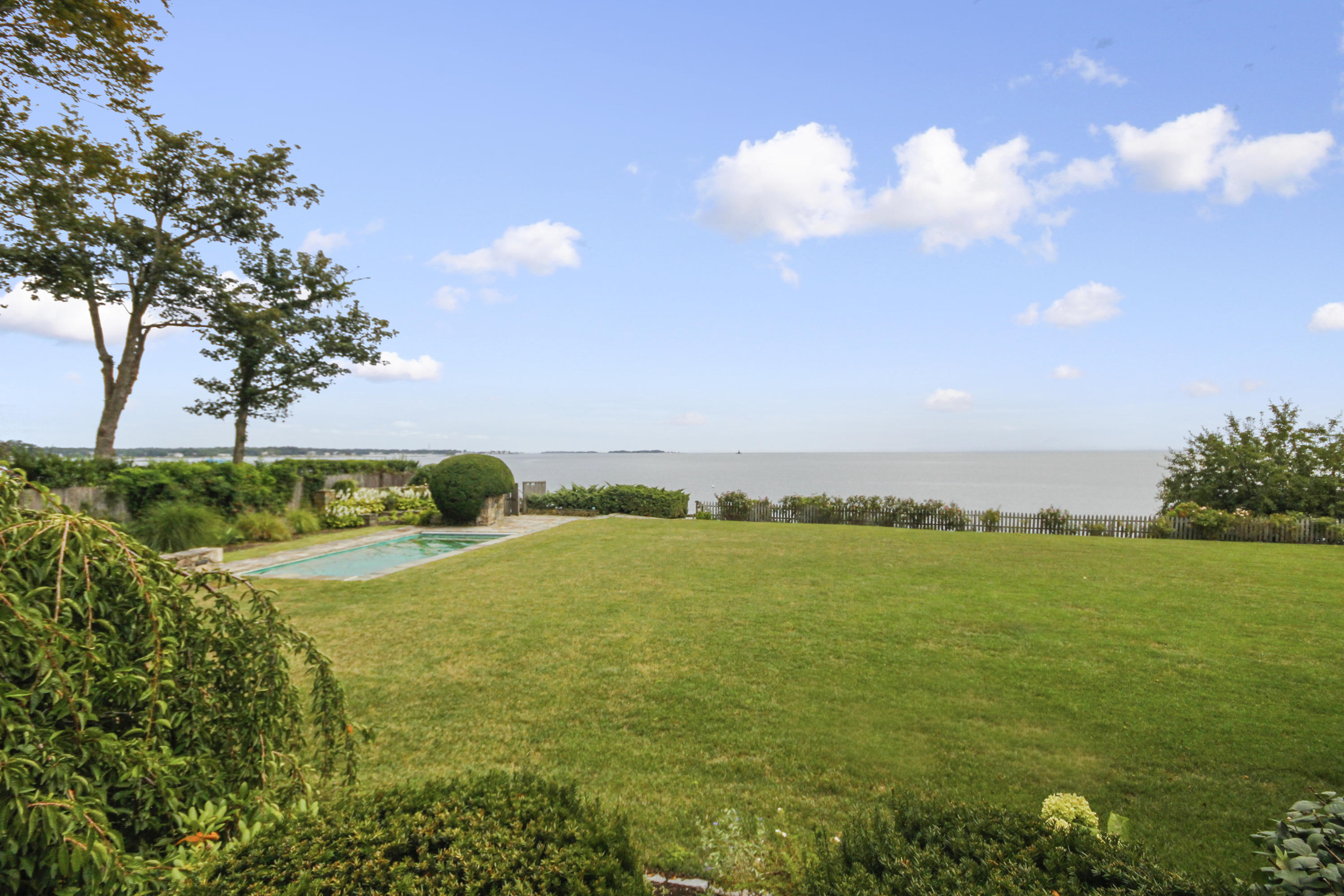 237 Long Neck Point Road Darien, CT 06820 - Photo 29 of 38 a view of an ocean and beach