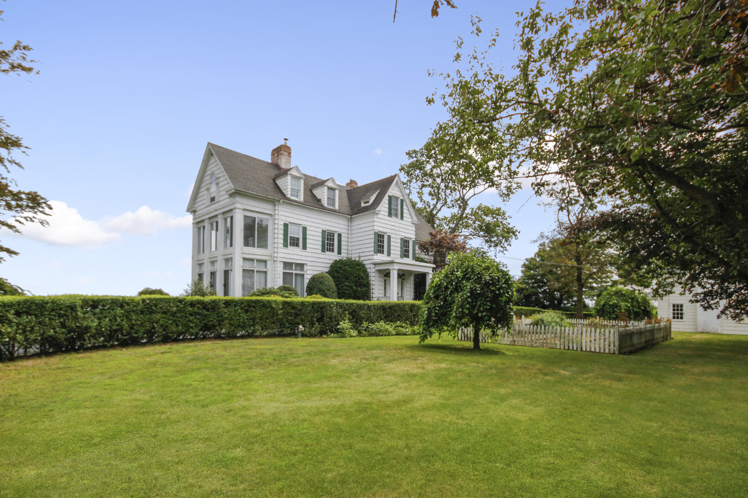 237 Long Neck Point Road Darien, CT 06820 - Photo 5 of 38 a view of a house with a yard