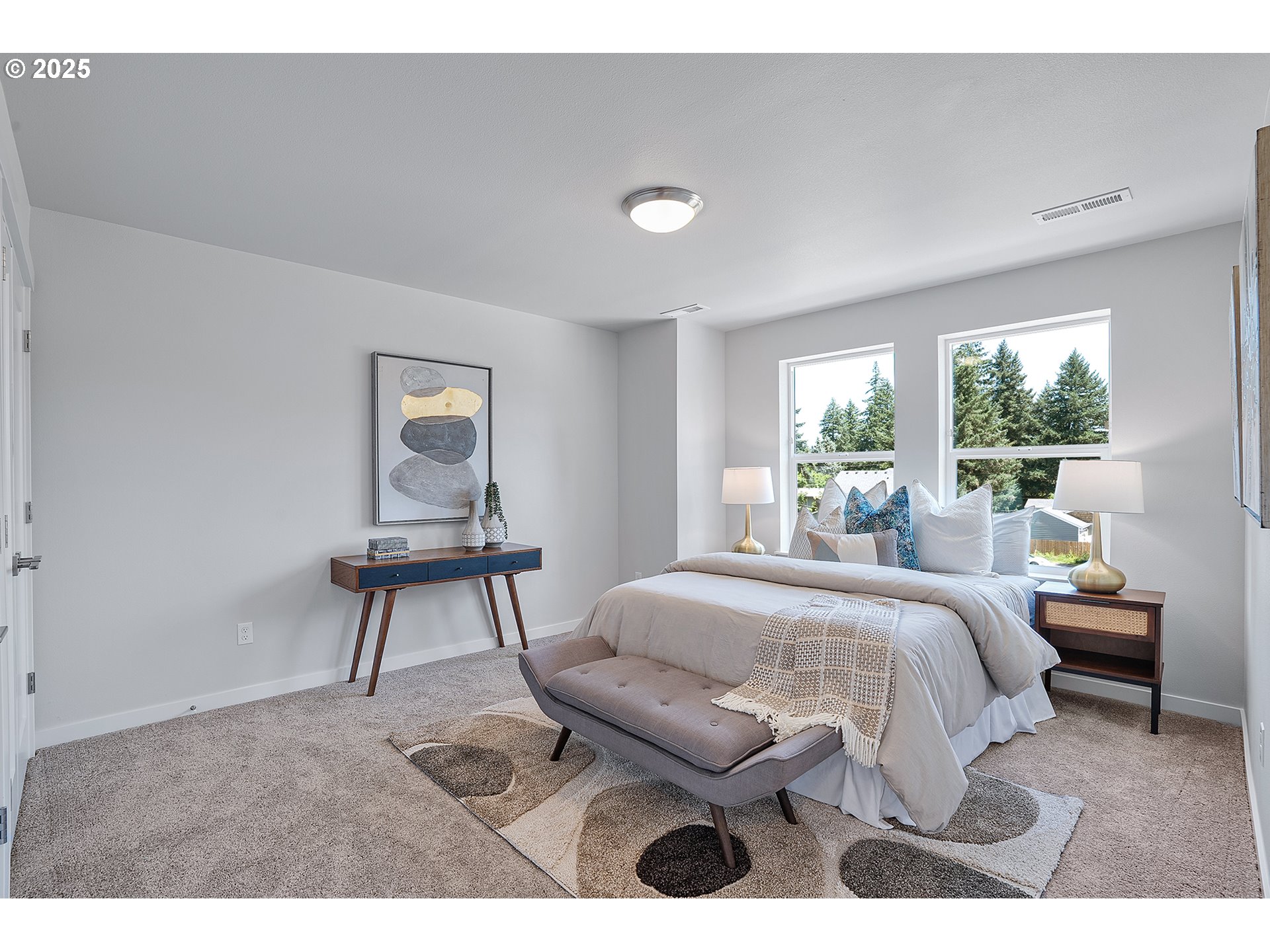 15149 East Burnside Street Portland, OR 97233 - Photo 15 of 21 a bedroom with a bed a table and chair