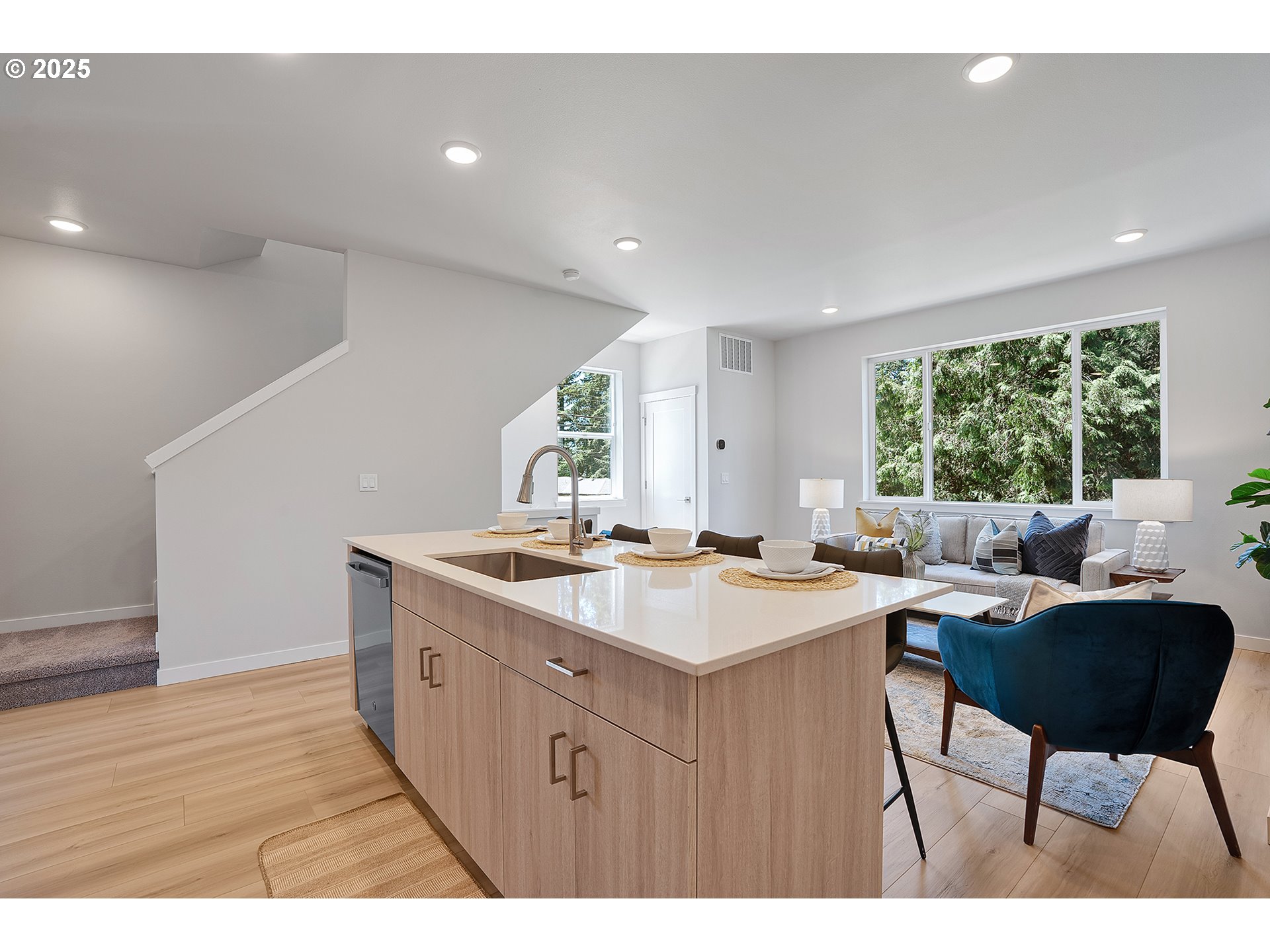 15149 East Burnside Street Portland, OR 97233 - Photo 8 of 21 a kitchen with a dining table chairs and white appliances