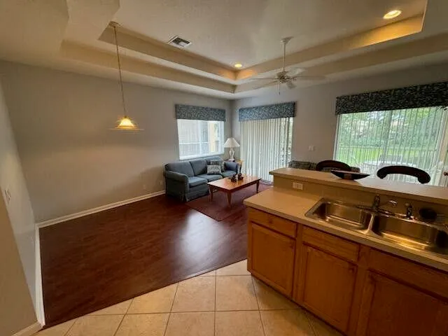 a kitchen with a refrigerator sink and stove
