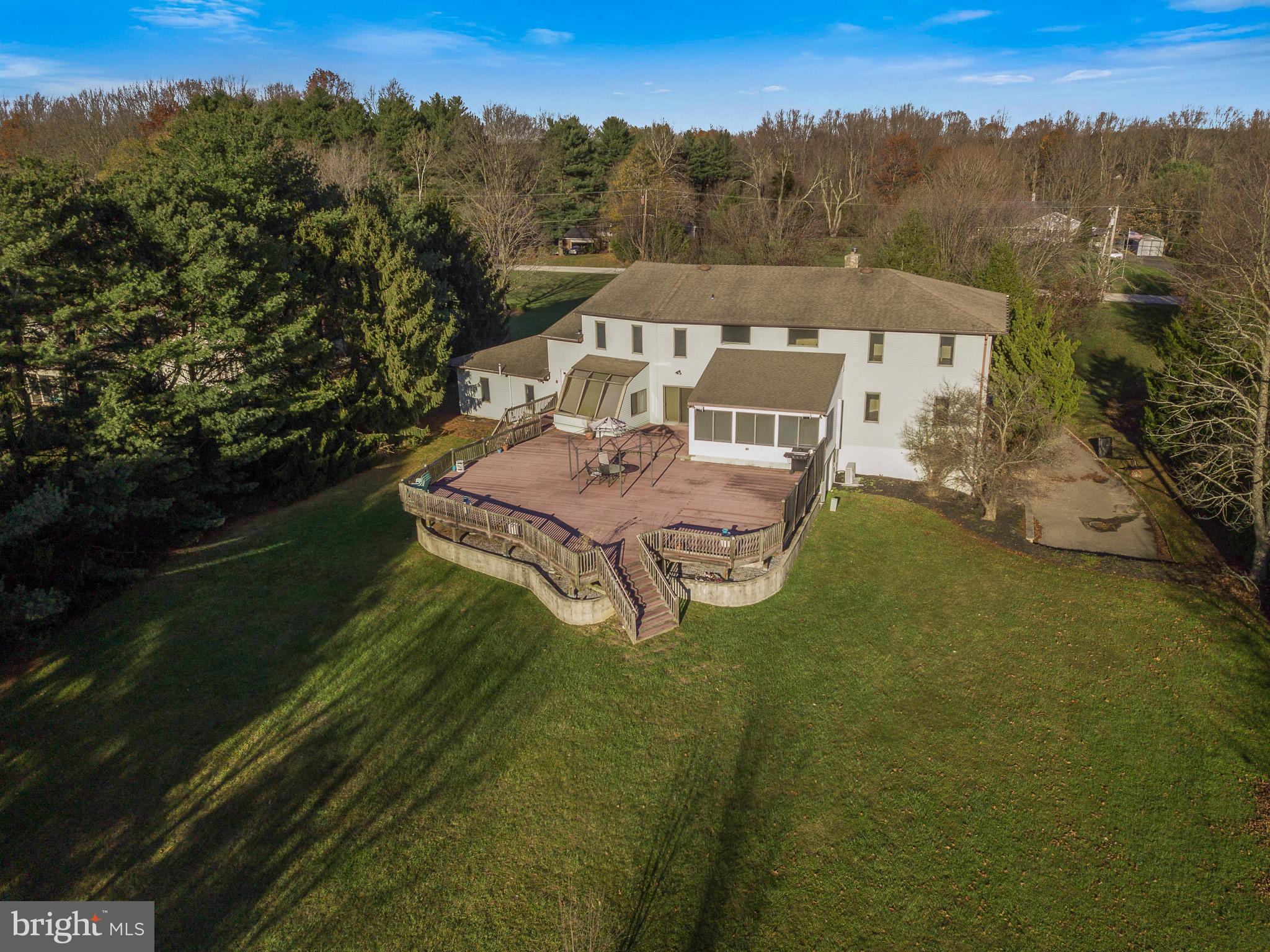 416 Ewan Road Mullica Hill, NJ 08062 - Photo 34 of 42 huge trex deck in the wide open backyard