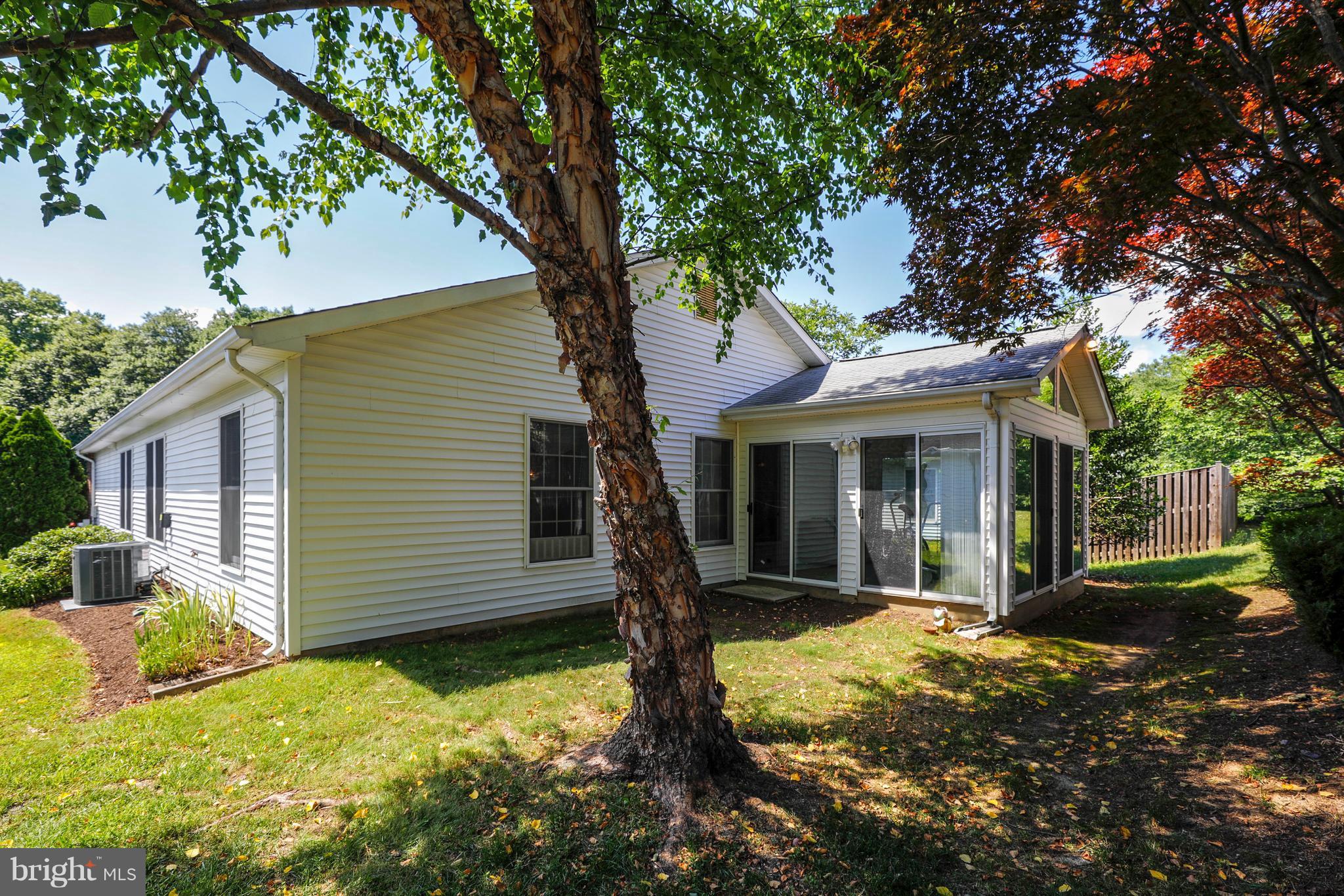Rear View of house and sunroom