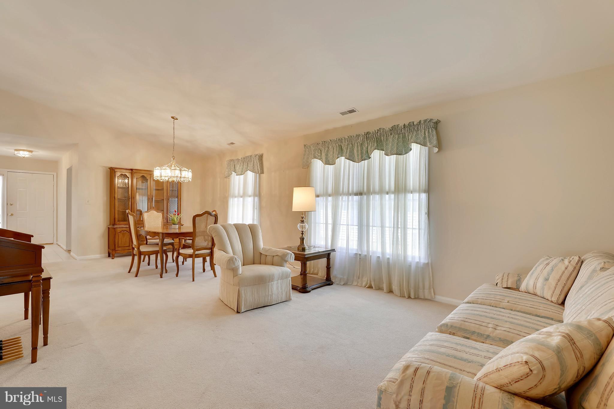 Open Living and Dining Room  w/vaulted ceiling