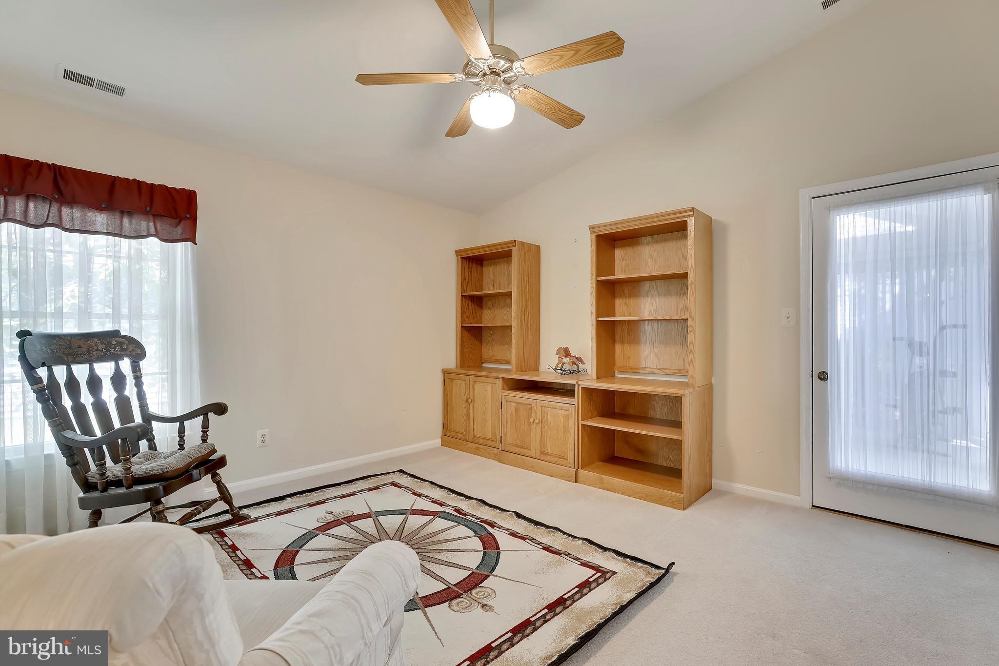 Family Room Leads to Sunroom through a French Door