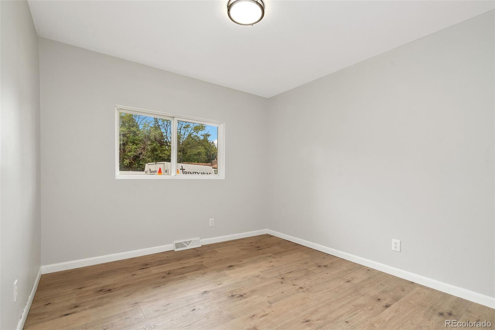 1304 South Lemay Avenue Fort Collins, CO 80524 - Photo 13 of 21 a view of empty room with wooden floor