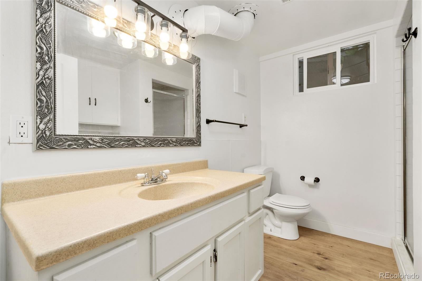 1304 South Lemay Avenue Fort Collins, CO 80524 - Photo 17 of 21 a bathroom with a sink and a mirror