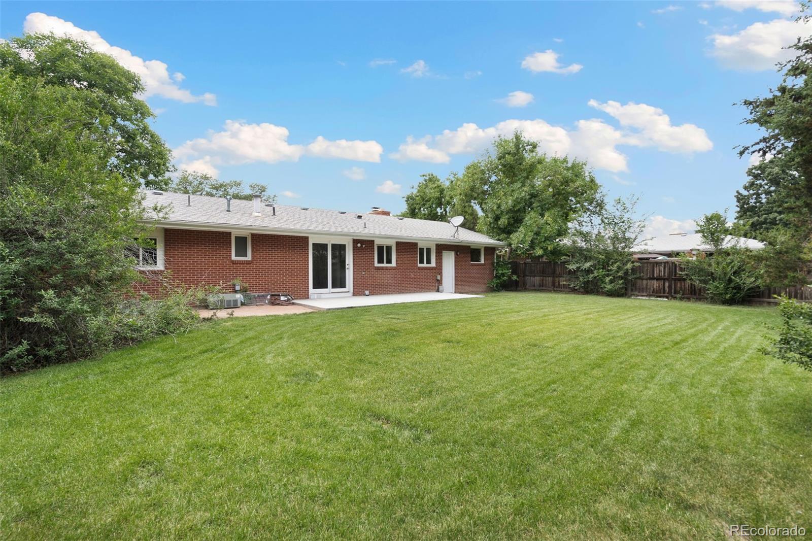 1304 South Lemay Avenue Fort Collins, CO 80524 - Photo 20 of 21 a view of a house with backyard and garden