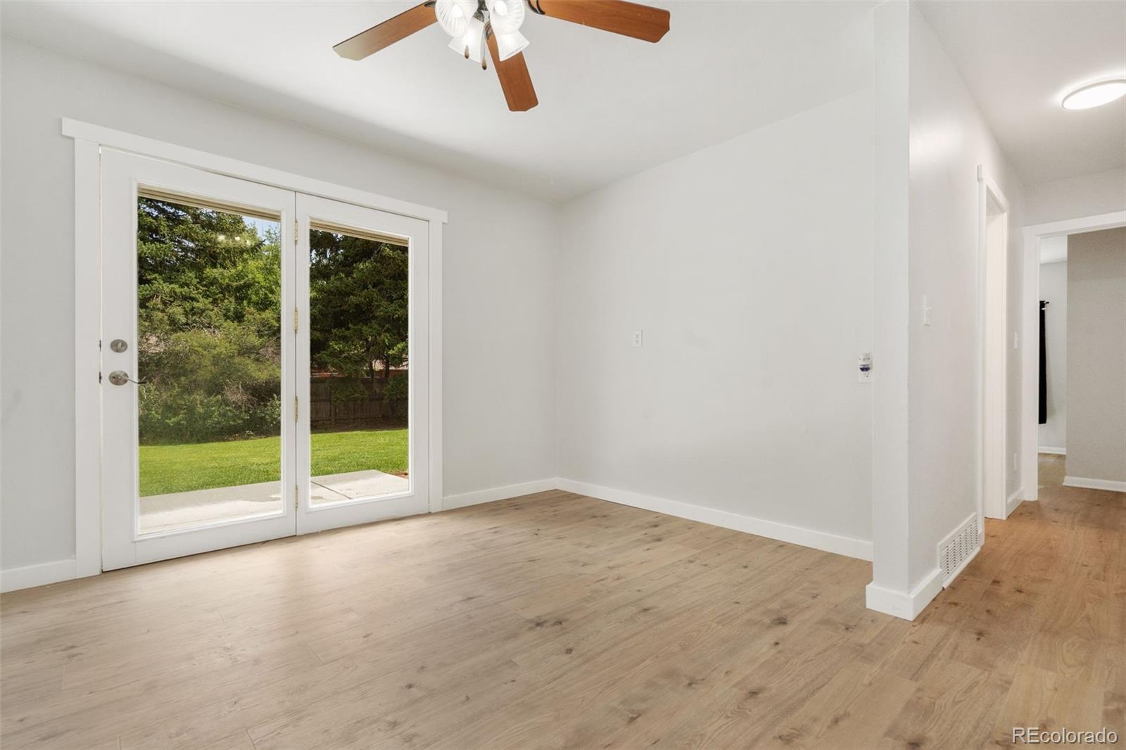 1304 South Lemay Avenue Fort Collins, CO 80524 - Photo 5 of 21 an empty room with ceiling fan and window