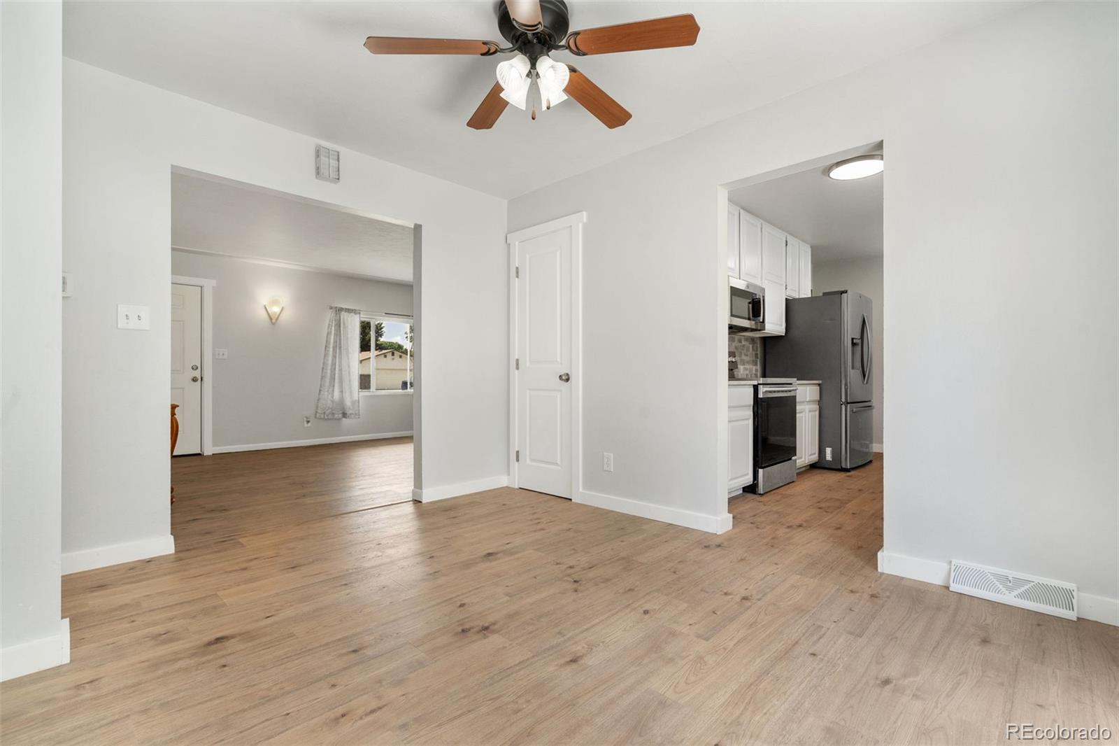 1304 South Lemay Avenue Fort Collins, CO 80524 - Photo 6 of 21 a view of a kitchen with a sink and a refrigerator