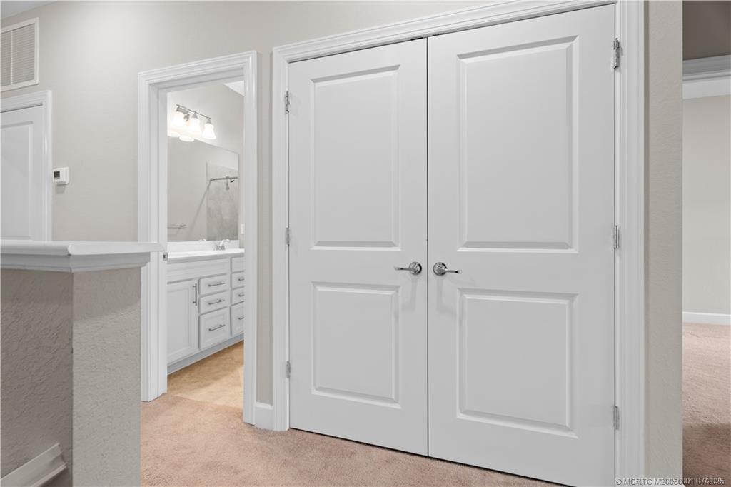 1857 Southeast Tarni Way Stuart, FL 34996 - Photo 12 of 21 an empty room with closet and mirror