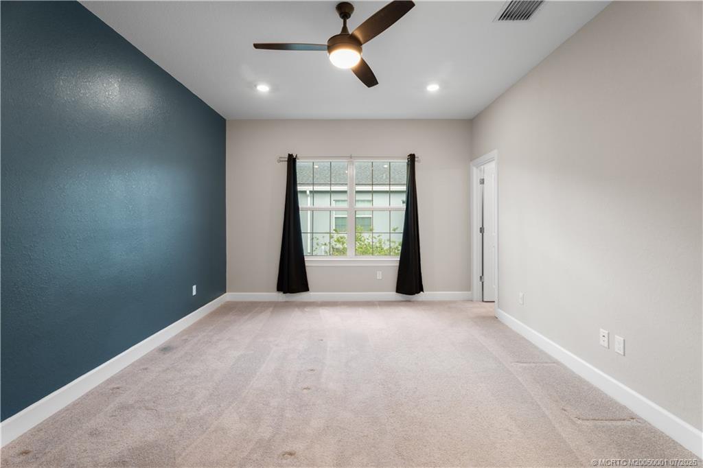 1857 Southeast Tarni Way Stuart, FL 34996 - Photo 17 of 21 a view of an empty room with a window