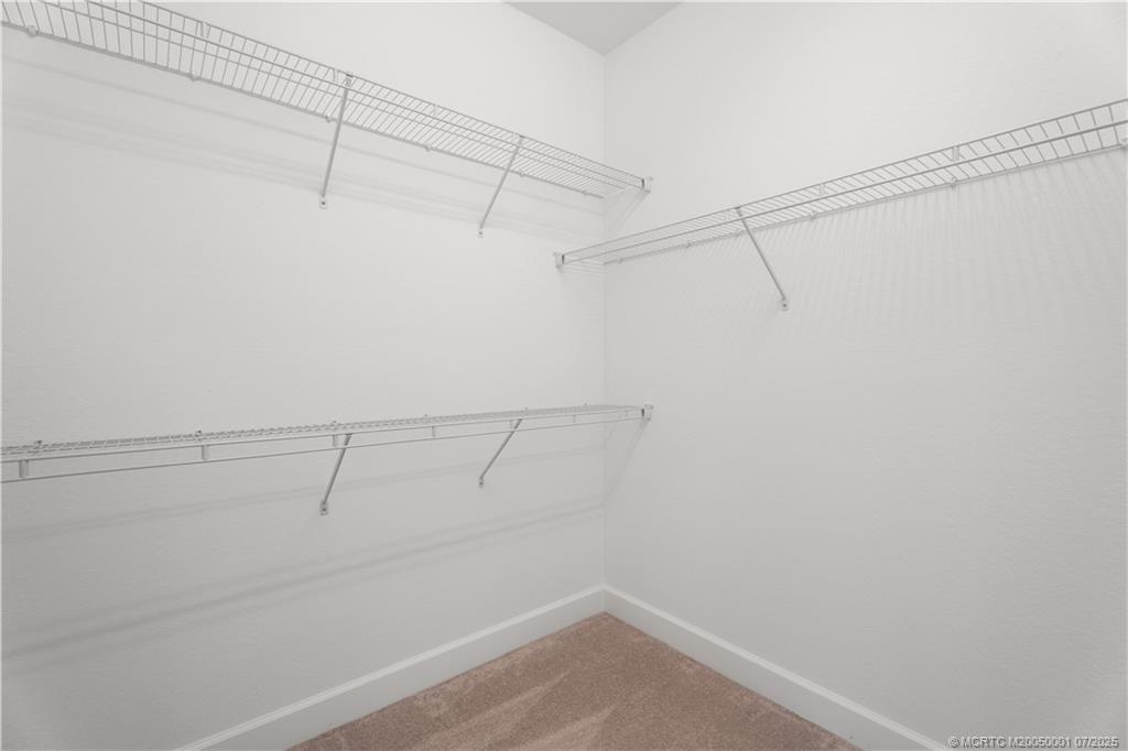 1857 Southeast Tarni Way Stuart, FL 34996 - Photo 18 of 21 a view of a room with racks on the wall