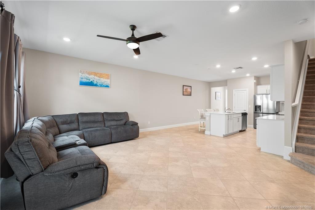 1857 Southeast Tarni Way Stuart, FL 34996 - Photo 7 of 21 a living room with furniture and kitchen view