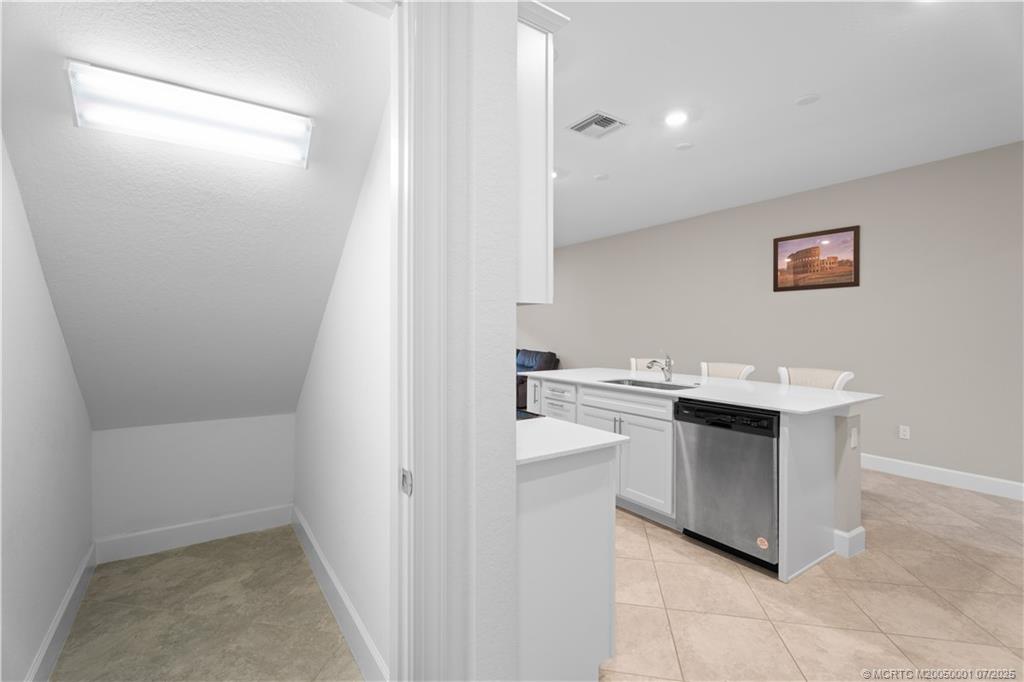 1857 Southeast Tarni Way Stuart, FL 34996 - Photo 10 of 21 a spacious bathroom with a sink a mirror and a bathtub