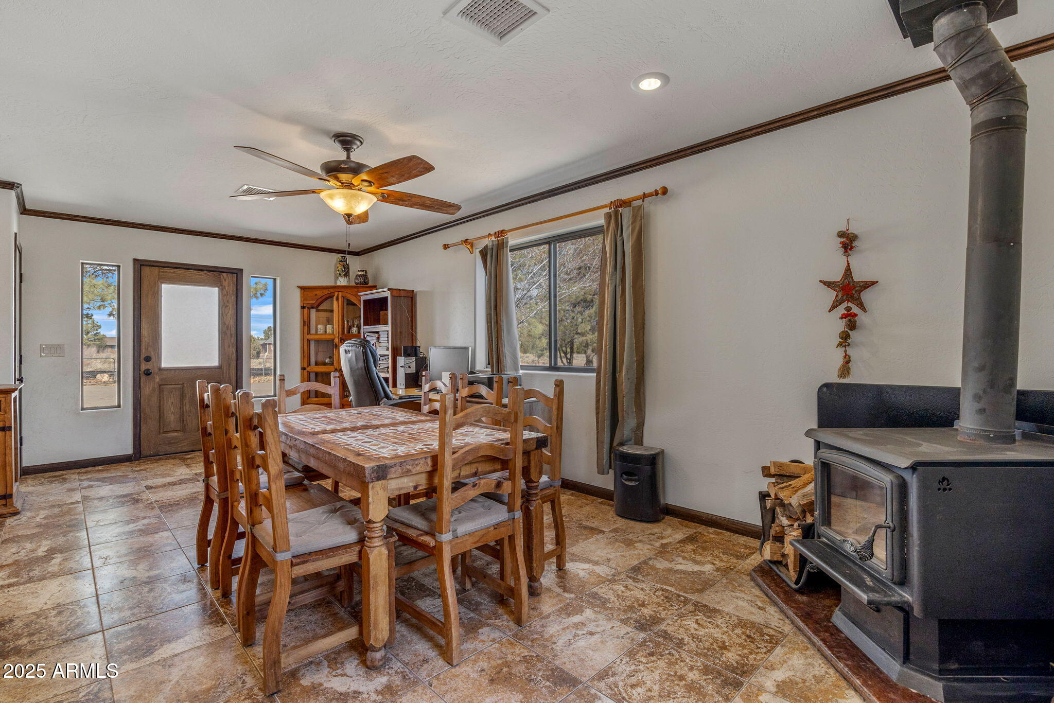 2727 Pine Meadow Drive Overgaard, AZ 85933 - Photo 13 of 34 a view of a dining room with furniture window and wooden floor
