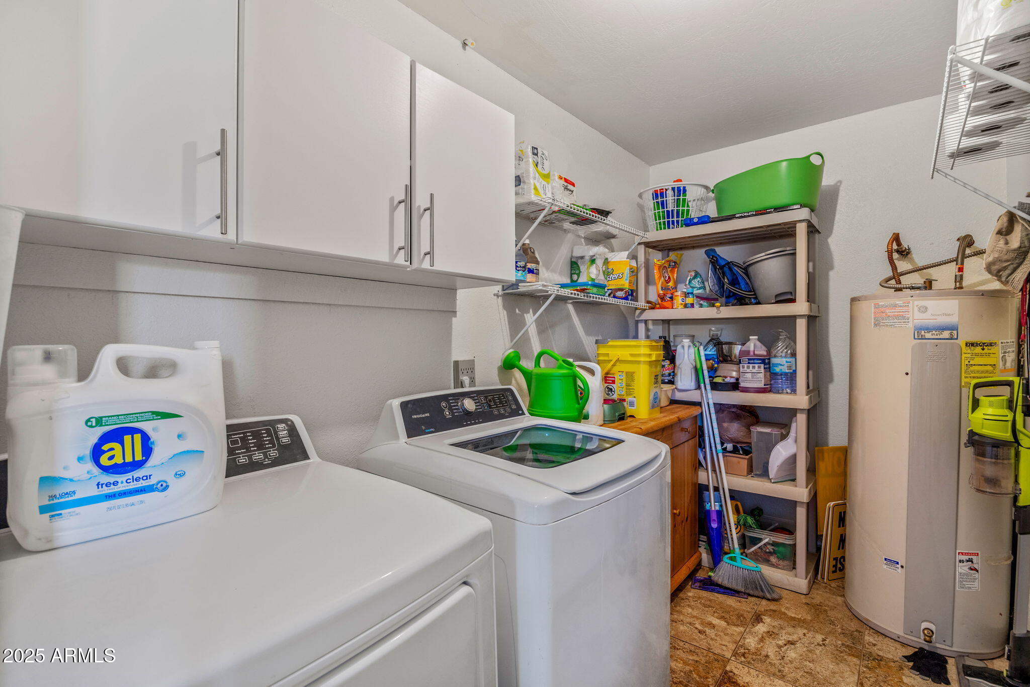 2727 Pine Meadow Drive Overgaard, AZ 85933 - Photo 20 of 34 a utility room with fridge dryer and book shelf
