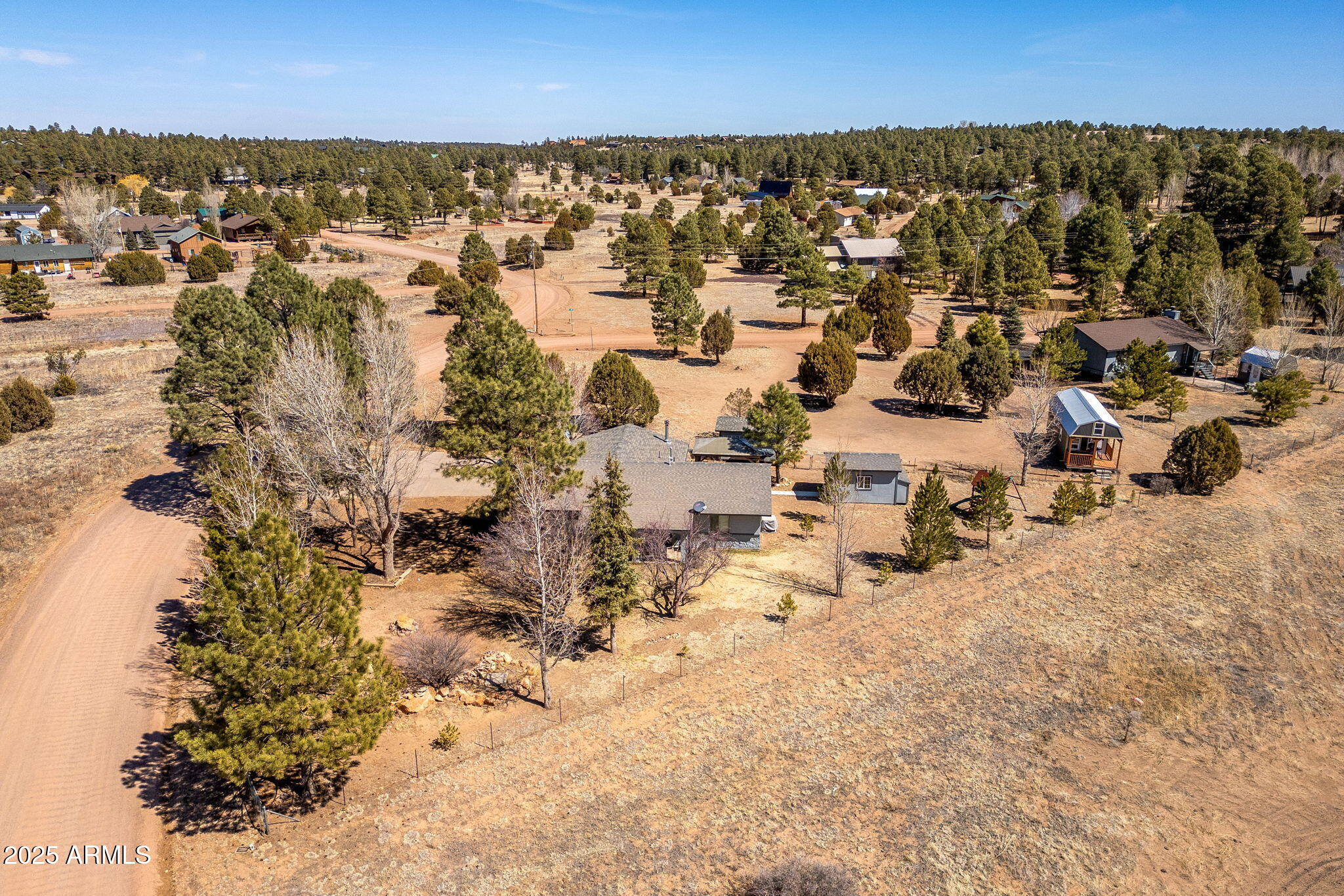2727 Pine Meadow Drive Overgaard, AZ 85933 - Photo 28 of 34 an aerial view of residential building with parking space