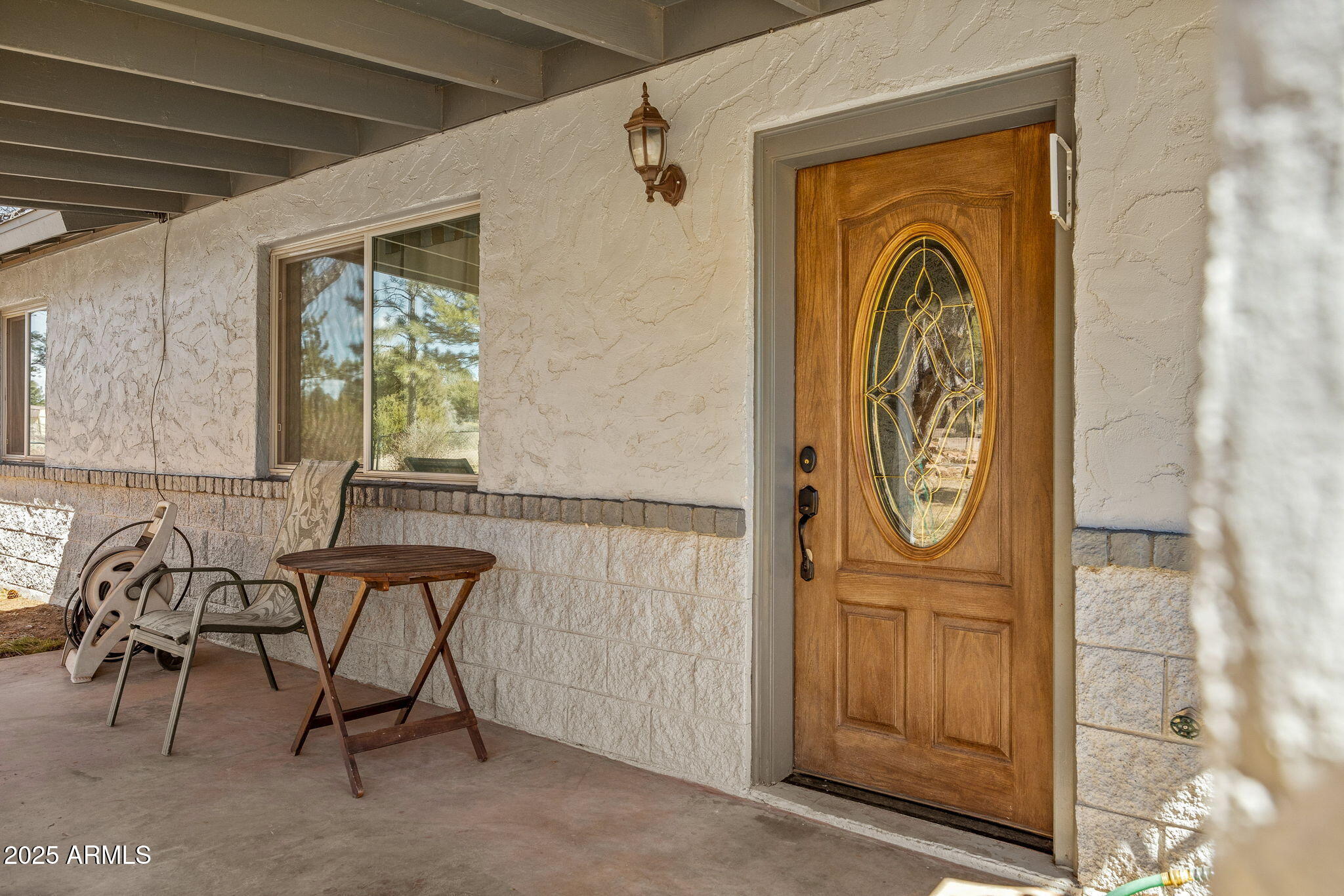 2727 Pine Meadow Drive Overgaard, AZ 85933 - Photo 4 of 34 a door with a bench in it