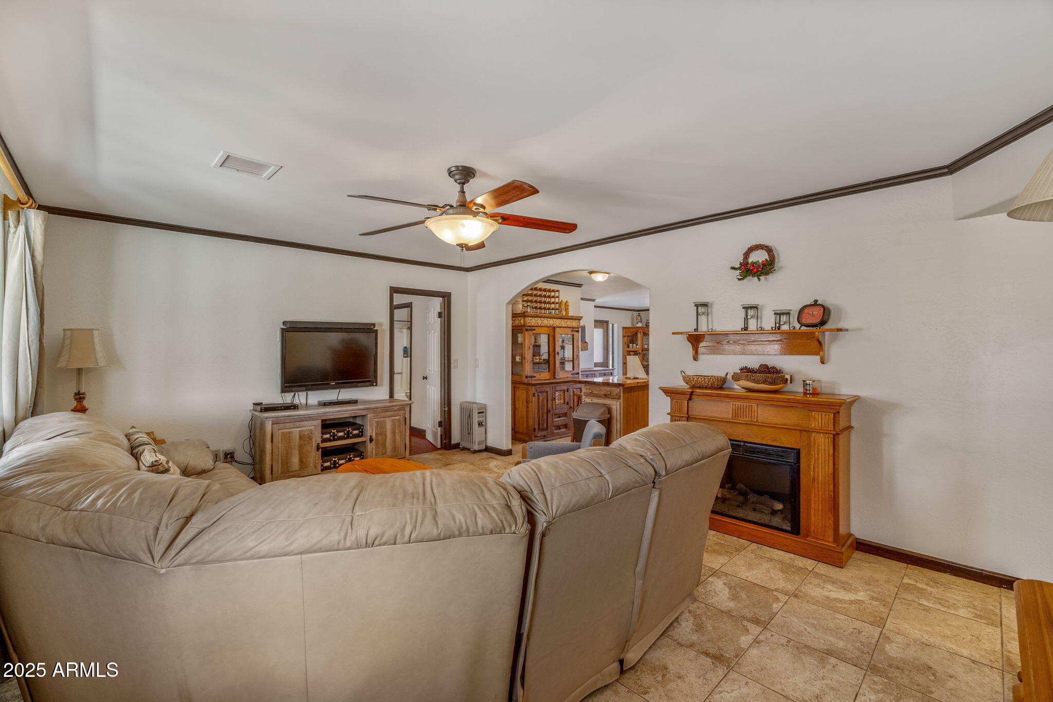2727 Pine Meadow Drive Overgaard, AZ 85933 - Photo 5 of 34 a living room with furniture and a flat screen tv