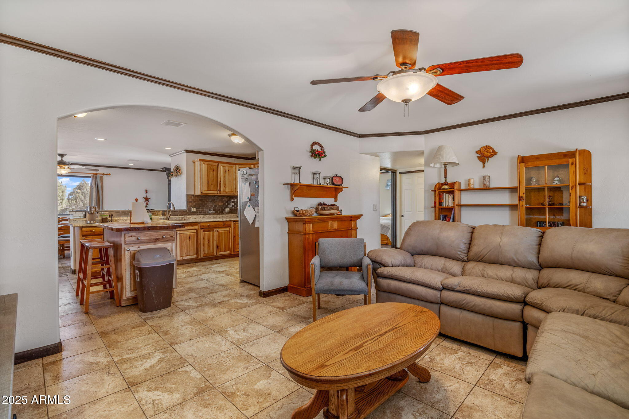 2727 Pine Meadow Drive Overgaard, AZ 85933 - Photo 7 of 34 a living room with furniture a table and kitchen view