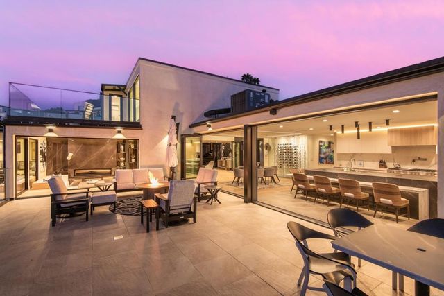 a building outdoor space with patio furniture and outdoor space