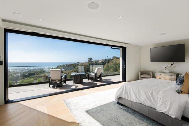 a living room with furniture fireplace and flat screen tv