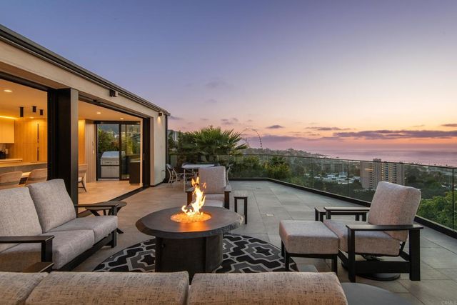 a view of a patio with couches table and chairs