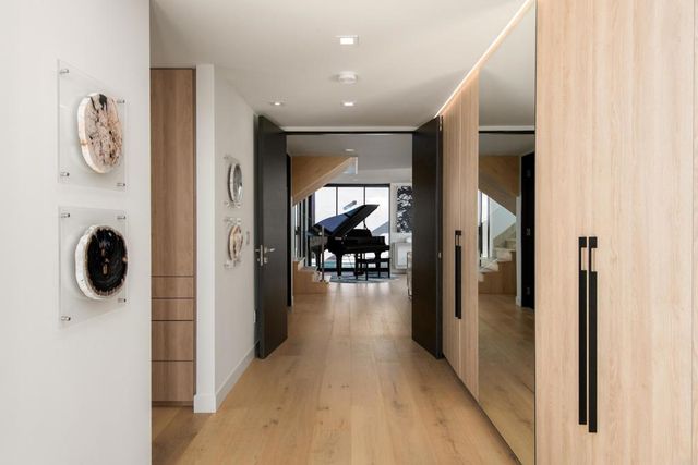 a view of a hallway with dining area