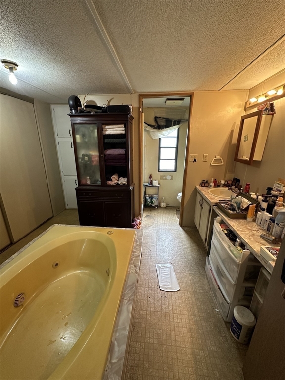 1 Independence Lane Warren, MA 01585 - Photo 13 of 16 a bathroom with a tub sink and mirror