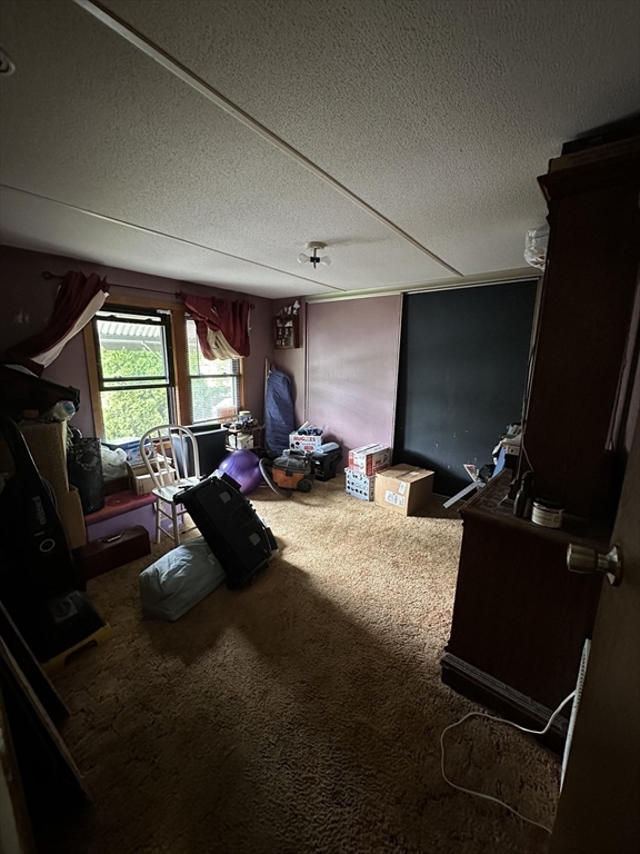 1 Independence Lane Warren, MA 01585 - Photo 10 of 16 a living room with furniture gym equipment and a large window