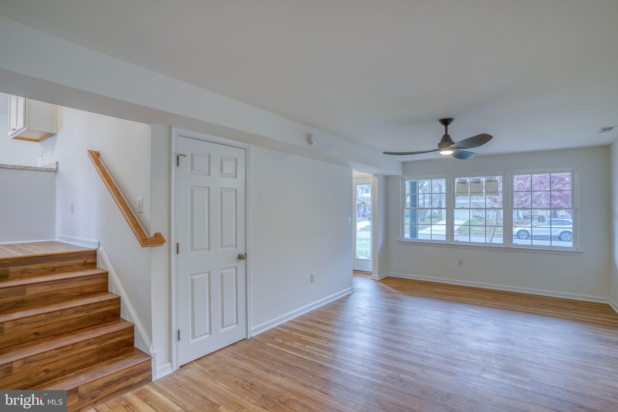 811 Sunset Terrace Dover, DE 19904 - Photo 17 of 45 a view of an empty room with wooden floor and fan