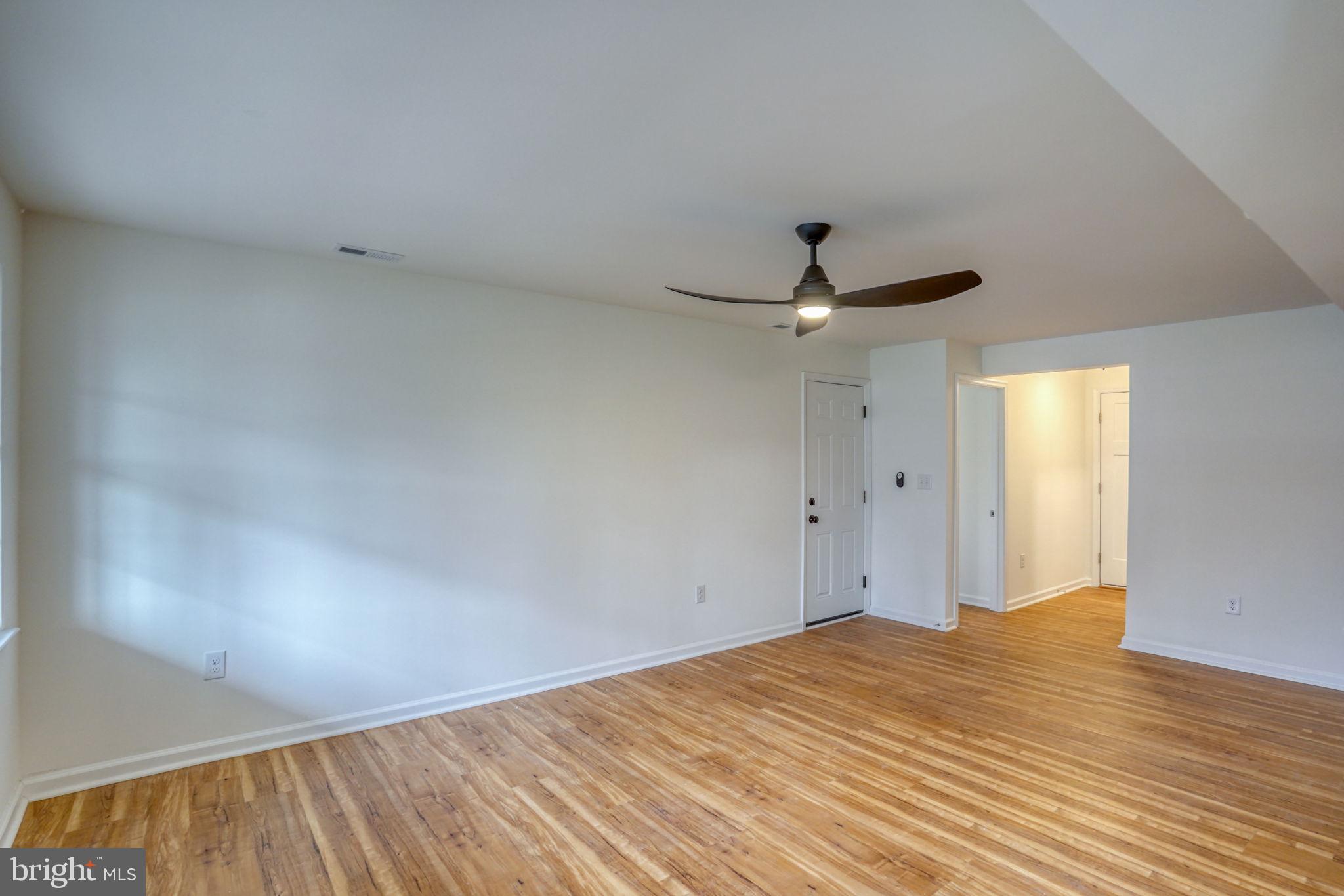 811 Sunset Terrace Dover, DE 19904 - Photo 21 of 45 a view of empty room with wooden floor and fan