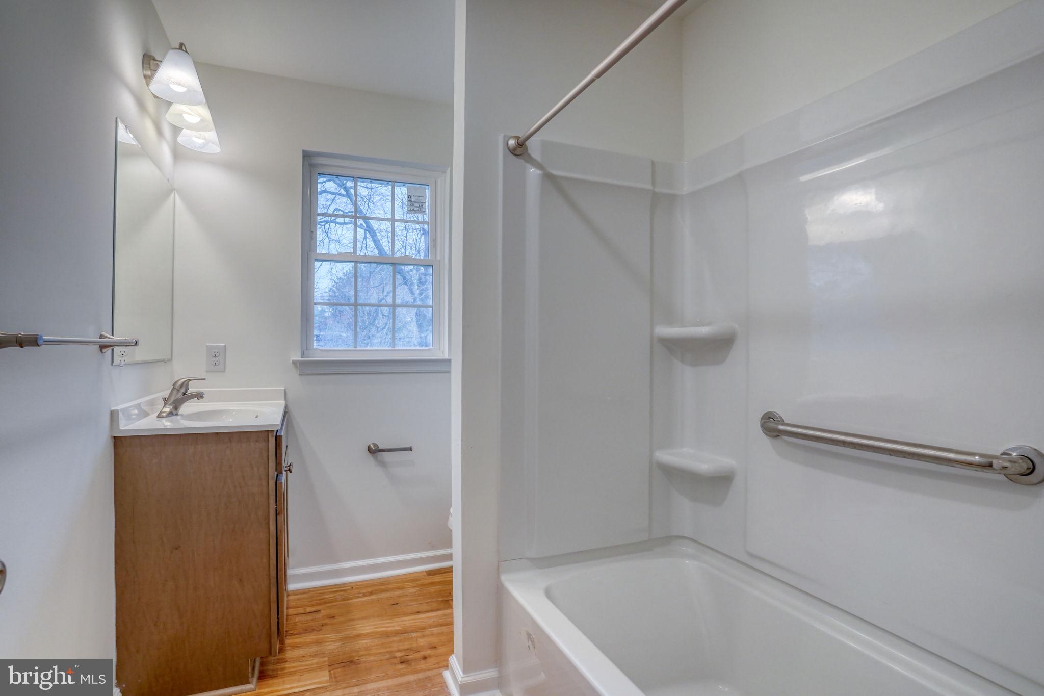 811 Sunset Terrace Dover, DE 19904 - Photo 30 of 45 a bathroom with a granite countertop sink a toilet and shower