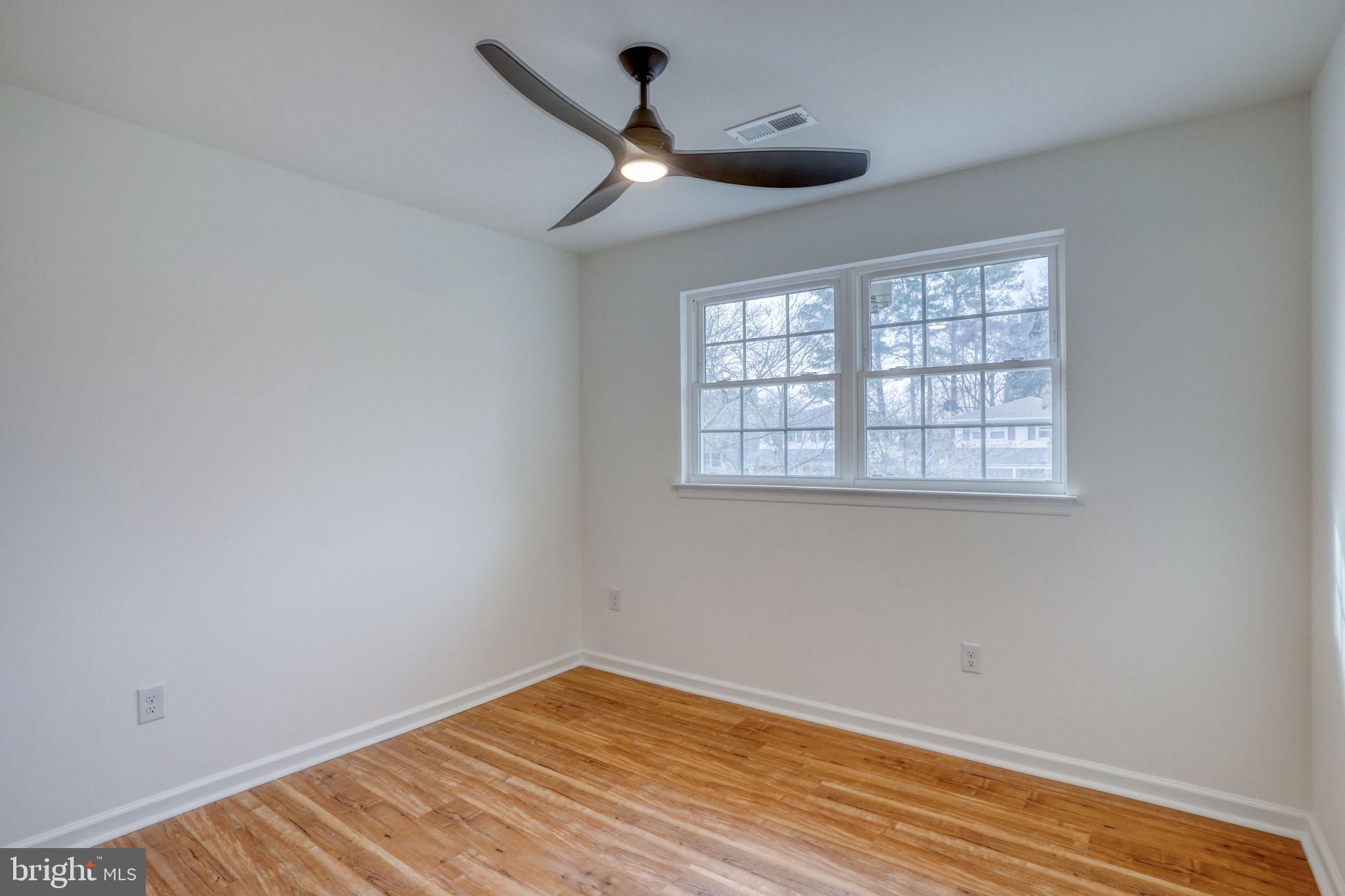 811 Sunset Terrace Dover, DE 19904 - Photo 32 of 45 wooden floor in an empty room with a window