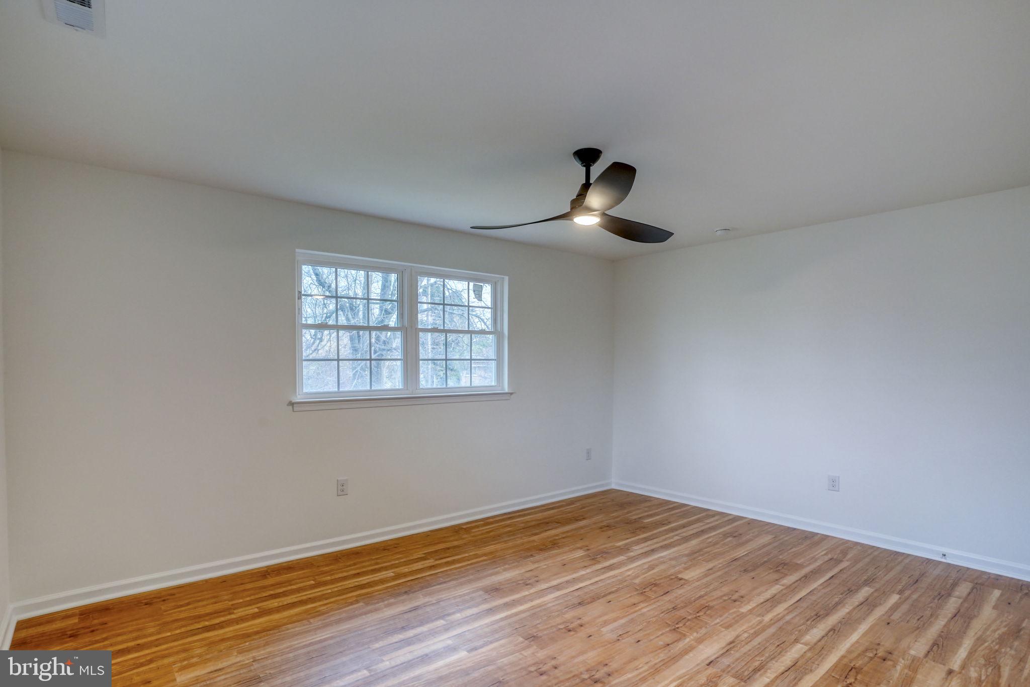 811 Sunset Terrace Dover, DE 19904 - Photo 33 of 45 a view of empty room with wooden floor