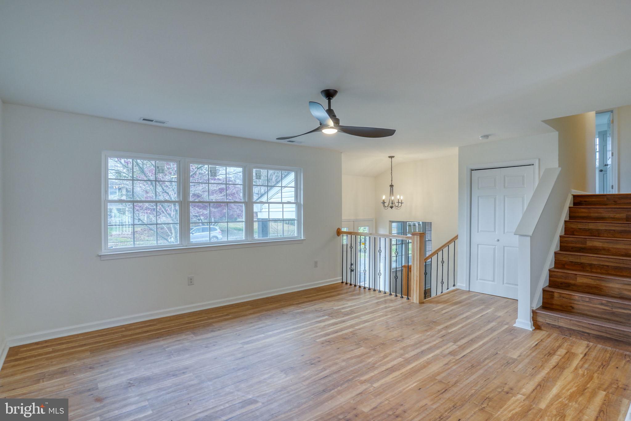 811 Sunset Terrace Dover, DE 19904 - Photo 8 of 45 a view of empty room with wooden floor and fan