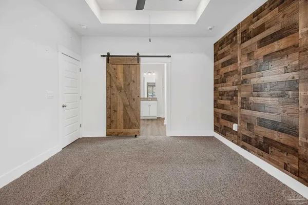 a view of an empty room with a fireplace