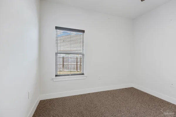 a bathroom with a granite countertop toilet a sink and a bathtub