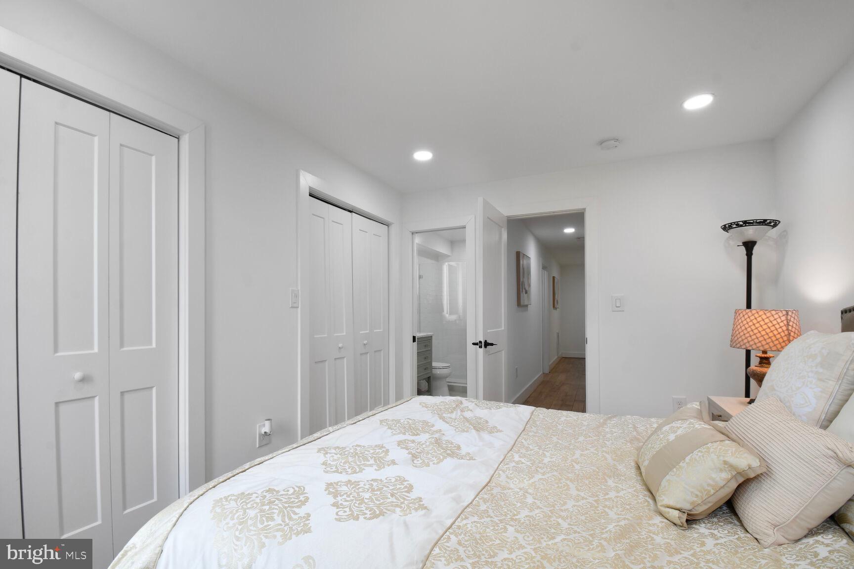 1427 K Street Southeast Washington, DC 20003 - Photo 19 of 30 a bedroom with a bed and a chandelier